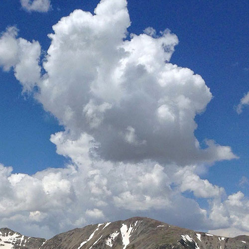 Cumulus cloud above mountain