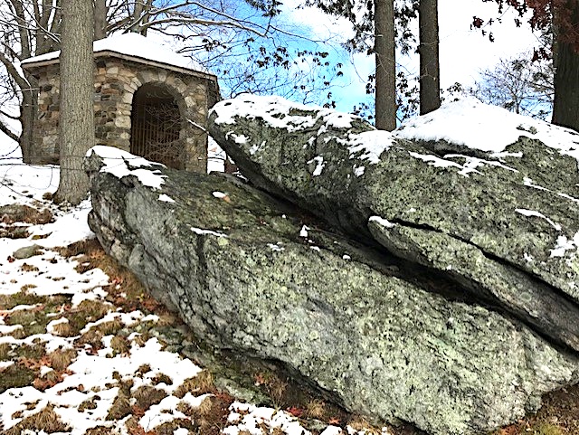 Photo of pavilion with rock slabs.